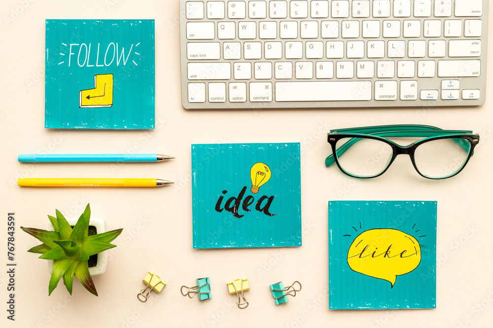 Fototapeta premium Like repost idea social media icon with keyboards and stationery, top view