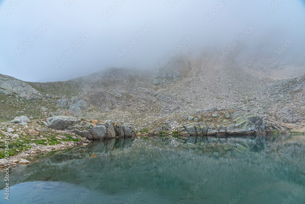 uludag glacial lake trekking and camping point reflection of the lake fog cloudy sky wonderful images of nature uludag glacial lake trekking and camping point reflection of the lake fog cloudy sky wonderful images of nature