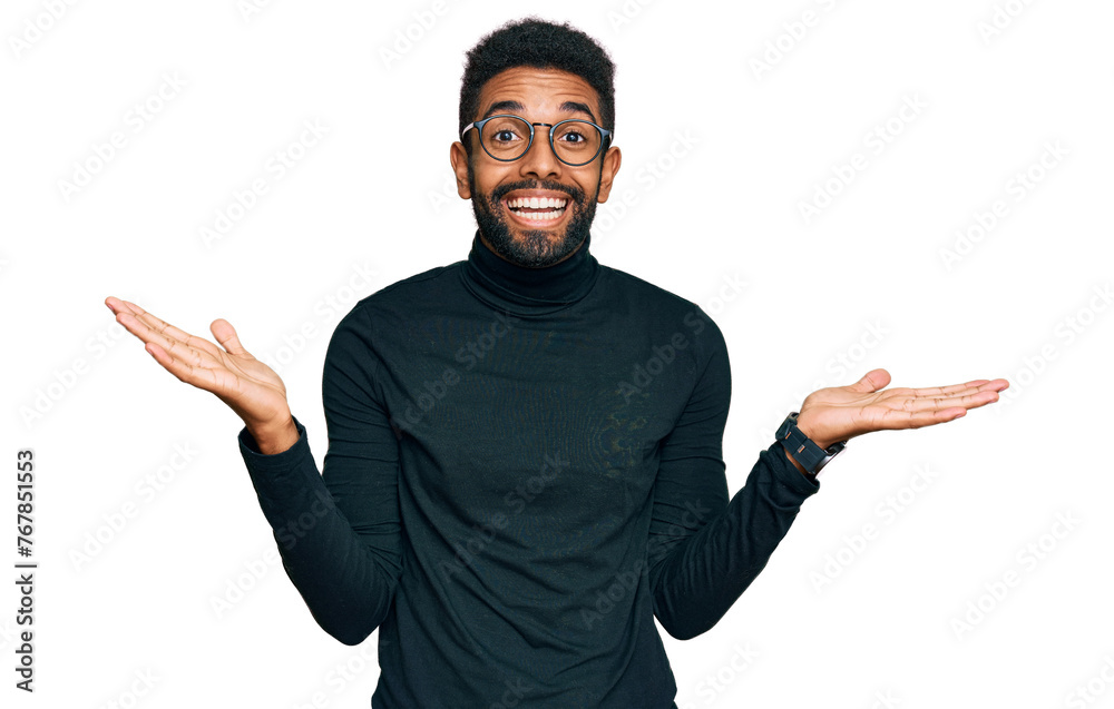 Young african american man wearing casual clothes celebrating victory with happy smile and winner expression with raised hands Young african american man wearing casual clothes celebrating victory with happy smile and winner expression with raised hands