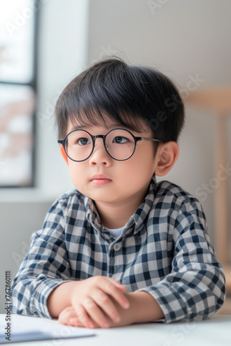 Portrait of asian little boy wearing eyeglasses.