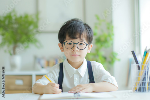 Portrait of asian little boy wearing eyeglasses.