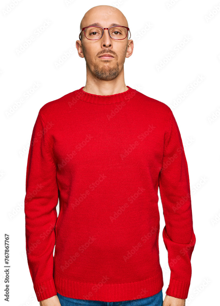 Bald man with beard wearing casual clothes and glasses with serious expression on face. simple and natural looking at the camera. Bald man with beard wearing casual clothes and glasses with serious expression on face. simple and natural looking at the camera.
