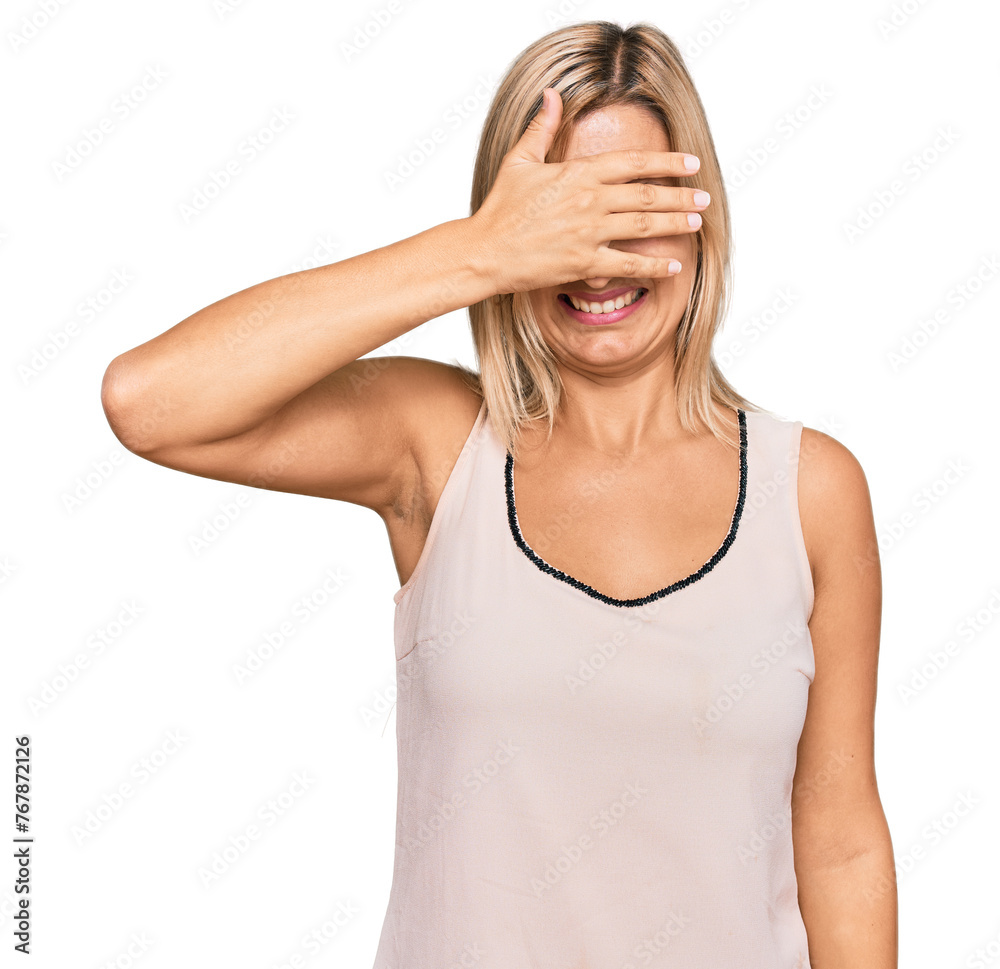 Middle age caucasian woman wearing casual clothes smiling and laughing with hand on face covering eyes for surprise. blind concept. Middle age caucasian woman wearing casual clothes smiling and laughing with hand on face covering eyes for surprise. blind concept.