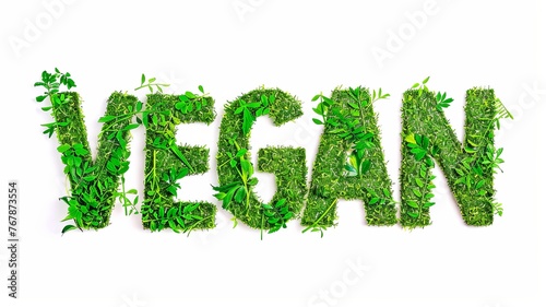 word vegan written in grass and leaves