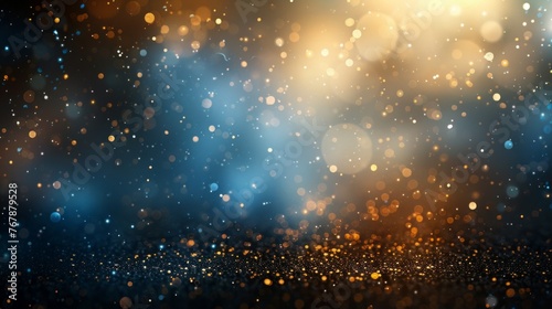 Abstract background of shimmering golden sparkles scattered across a deep blue backdrop. © red_orange_stock