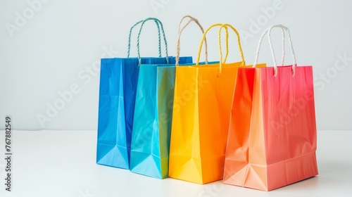 On a white background, colourful shopping bags are isolated