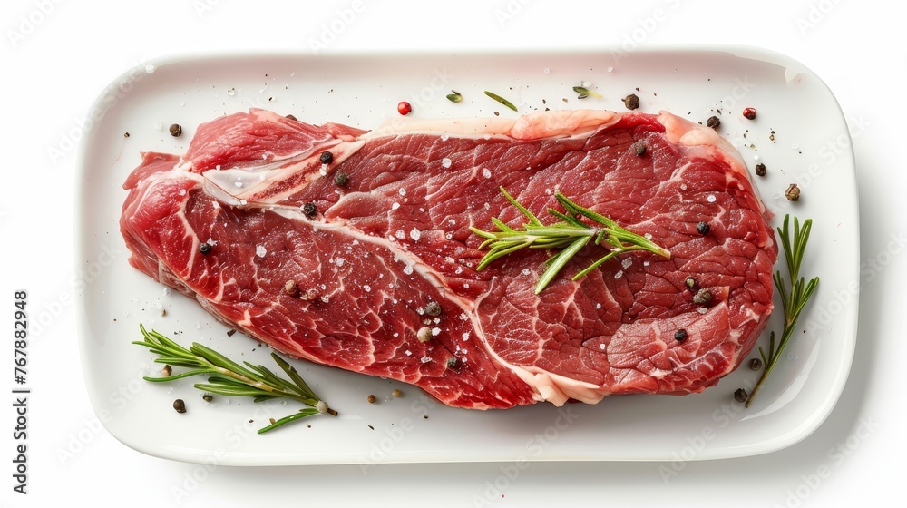 Isolated raw beef steak on white background, top view