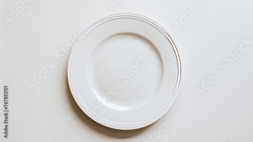 An image of a white plate placed against a white background