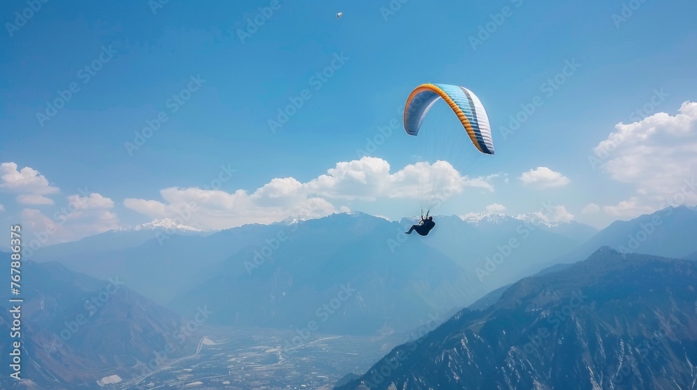 Paraglider soaring high with a breathtaking view of the mountains below, freedom theme no dust Paraglider soaring high with a breathtaking view of the mountains below, freedom theme no dust