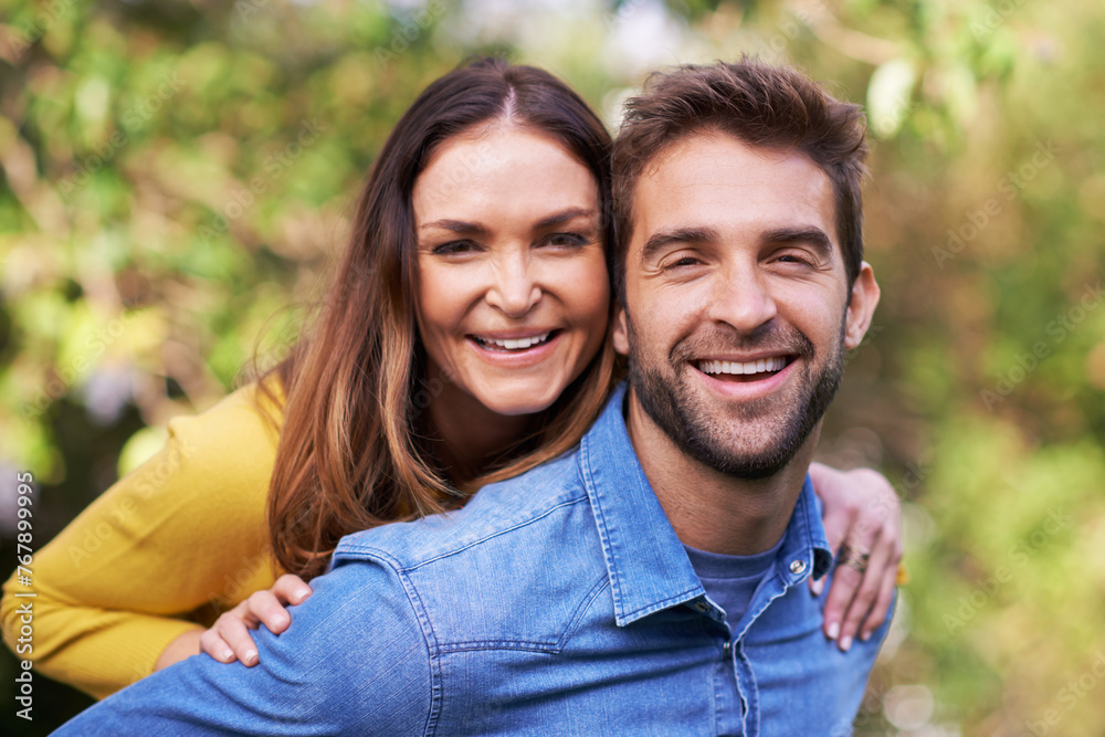 Portrait, nature and happy couple with piggyback in park for bonding, dating and relationship outdoor. People, love and romantic in backyard with smile or joy, excited and commitment in marriage Portrait, nature and happy couple with piggyback in park for bonding, dating and relationship outdoor. People, love and romantic in backyard with smile or joy, excited and commitment in marriage