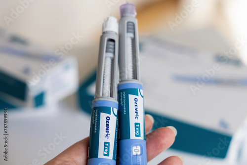 Fototapeta Naklejka Na Ścianę i Meble -  Hand holding Ozempic Insulin injection pen for diabetics. Denmark - March 25, 2024