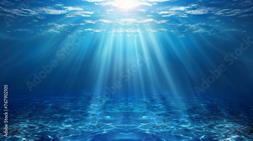 Ocean background - Sun shining light sunlight sunshine in blue clearly deep water, sunbeams illuminate the blue underwater sea scene photo