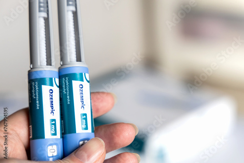 Hand holding Ozempic Insulin injection pen for diabetics. Denmark - March 25, 2024 photo