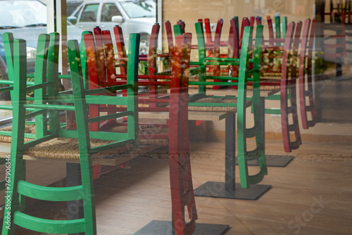 restaurant with a lot of green and red chairs