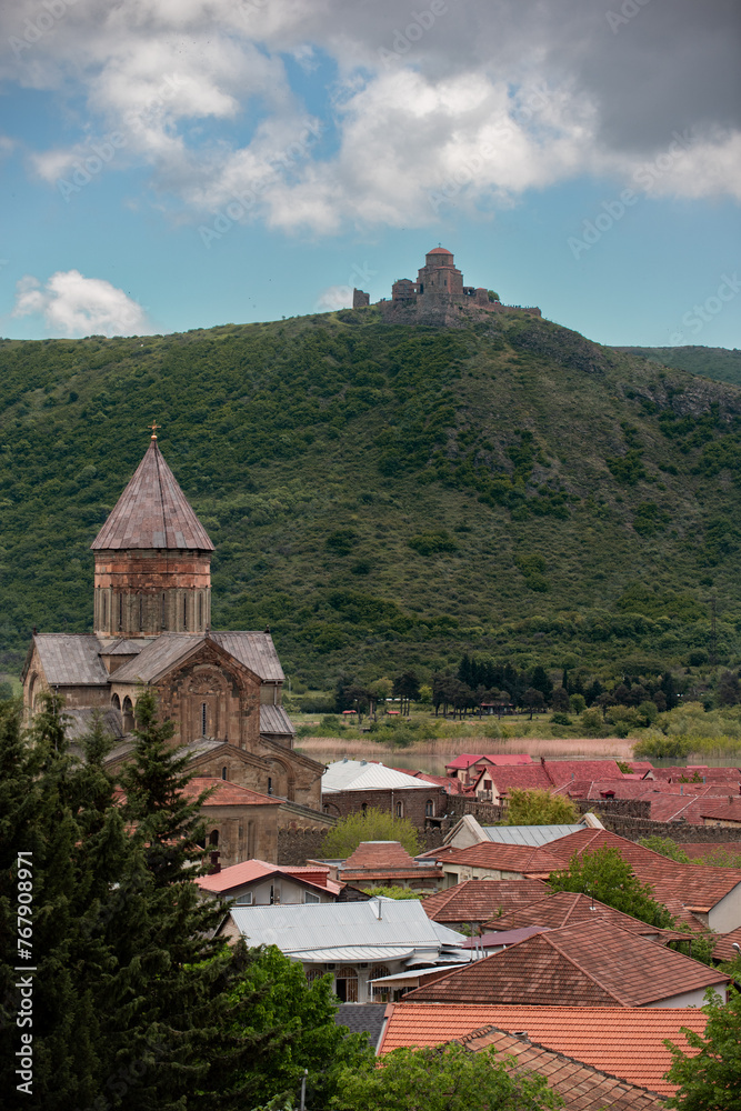 The Svetitskhoveli Cathedral, an Orthodox Christian cathedral and Jvari Church in the distance, in the historic town of Mtskheta, Georgia.
