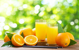 glasses of fresh orange juice with fresh fruits