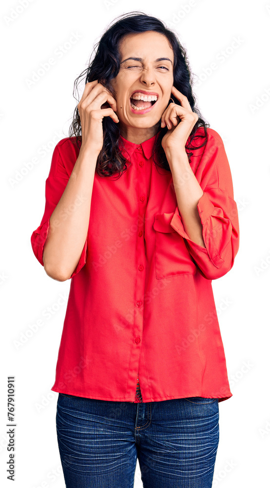 Young beautiful hispanic woman wearing casual clothes covering ears with fingers with annoyed expression for the noise of loud music. deaf concept. Young beautiful hispanic woman wearing casual clothes covering ears with fingers with annoyed expression for the noise of loud music. deaf concept.