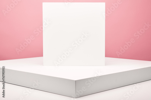 Square frame for your text is on flat box, platform on pink.