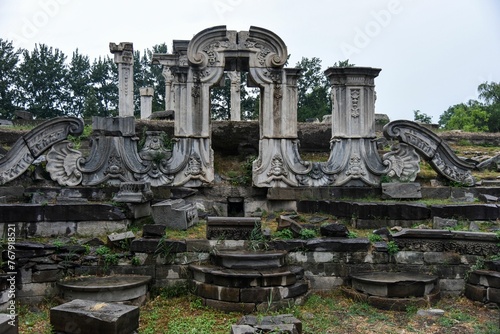 Close-up of the ruins of the Yuanmingyuan Summer Palace, with the entrance still standing © Wirestock