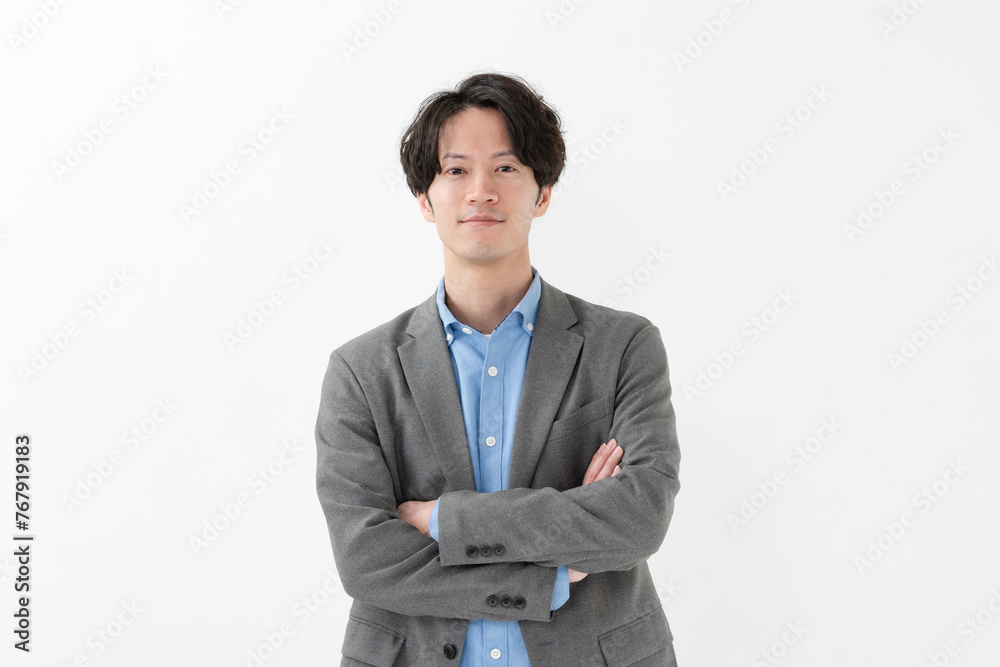 Naklejka premium 腕組みするビジネスマン