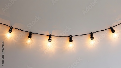 hanging string of lights on a white background 