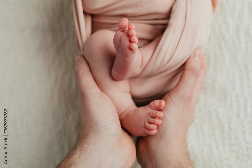 Newborn baby feet in parents hands
Newborn baby feet in parents hands