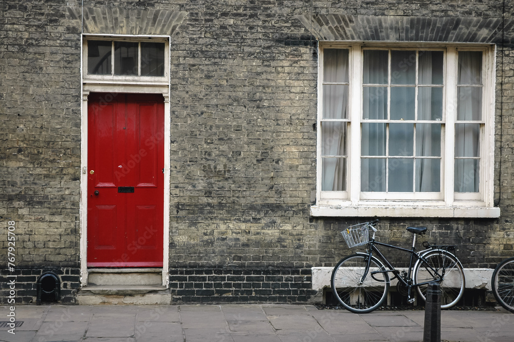 Red door of a hosue in Cambridge city, England, UK
