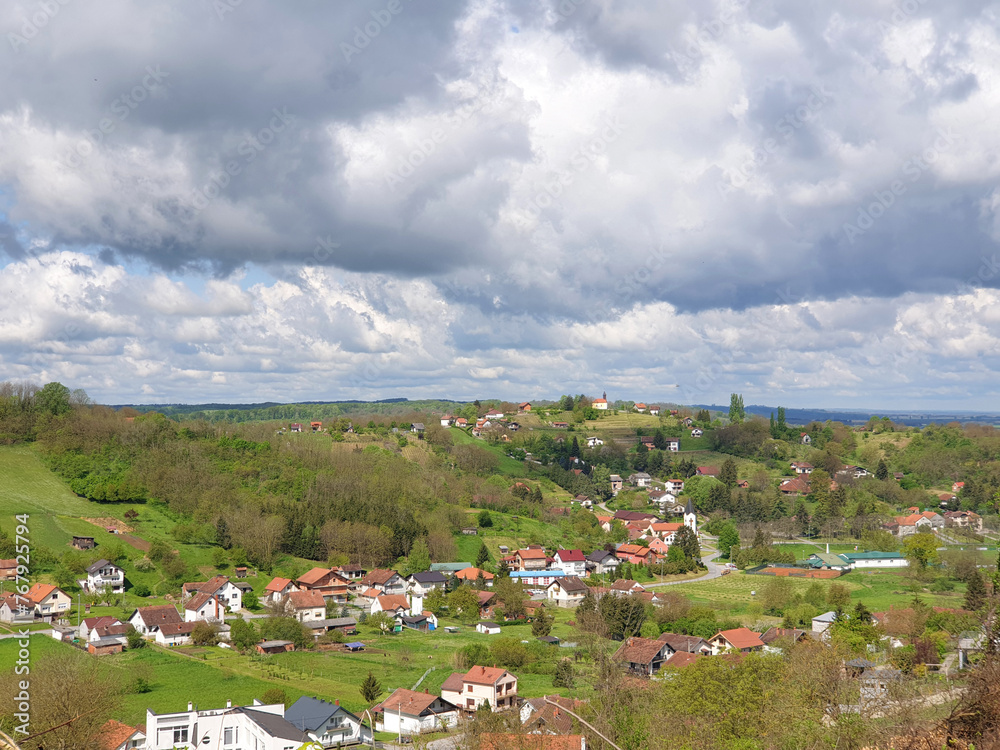 village Milanovac in Virovitica-Podravina County on green hills - spring landscape, Croatia