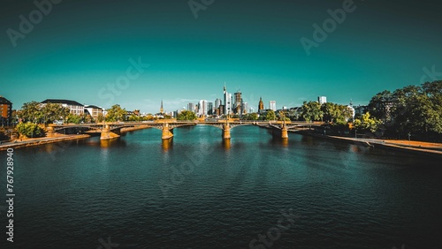 Ignatz Bubis Bridge over River Main on a sunny day at Frankfurt, Germany photo