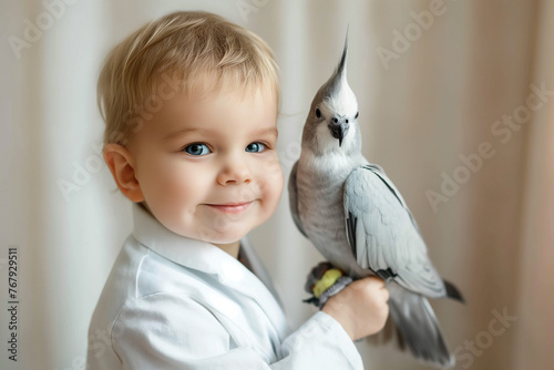 Photo of Baby zoologist with a cute bird photo
