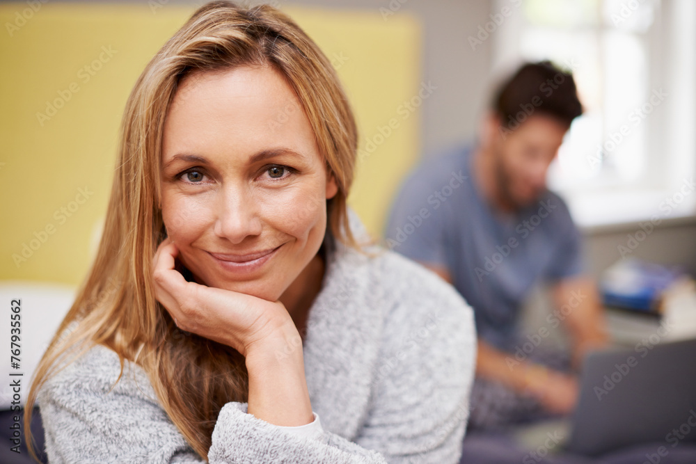 Smile, portrait and woman on bed in home with husband work on laptop for remote freelancer job. Happy, couple and female person with positive attitude in bedroom with man typing on computer at house. Smile, portrait and woman on bed in home with husband work on laptop for remote freelancer job. Happy, couple and female person with positive attitude in bedroom with man typing on computer at house.