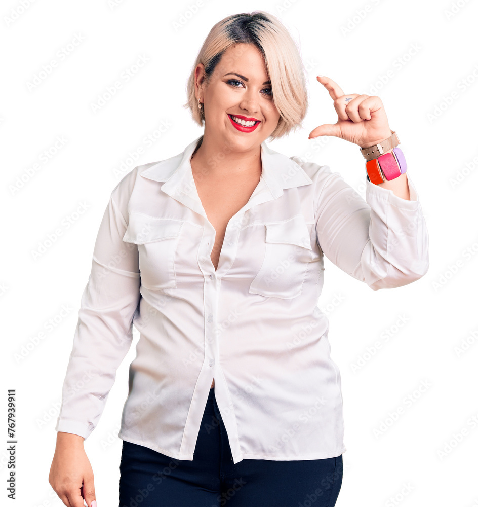 Young blonde plus size woman wearing casual shirt smiling and confident gesturing with hand doing small size sign with fingers looking and the camera. measure concept. Young blonde plus size woman wearing casual shirt smiling and confident gesturing with hand doing small size sign with fingers looking and the camera. measure concept.