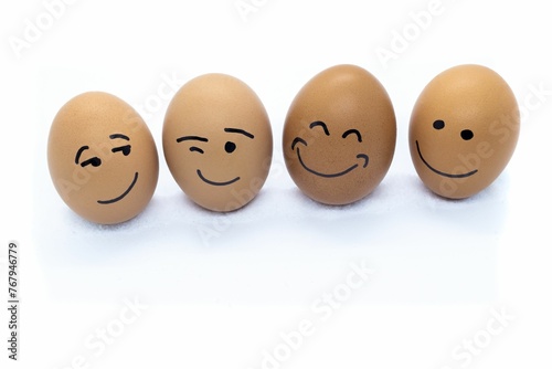 Collection of multicolored eggs with human facial features drawn upon them, arranged in a circle