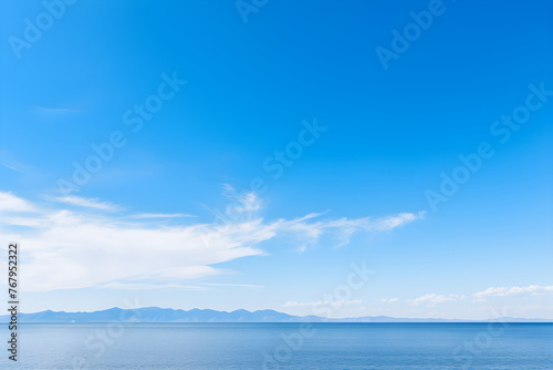Boundless Azure: An Expanse of Clear Blue Sky Merging with the Horizon © Lelia