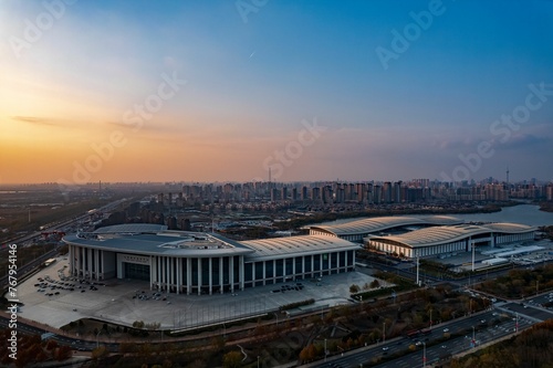 Vászonkép Aerial shot of Tianjin Meijiang Convention and Exhibition Center, China at sunse