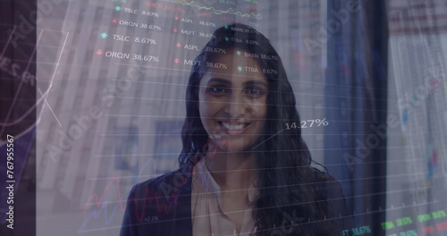 Stock market processing over portrait of indian woman smiling at office