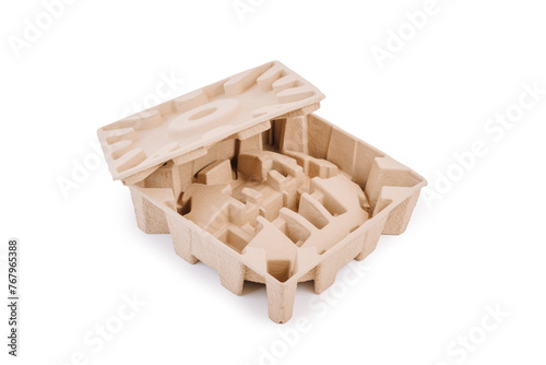 Two pieces of molded cardboard packaging with various slots and holes, likely for securing delicate items, stacked on top of each other against a white background.