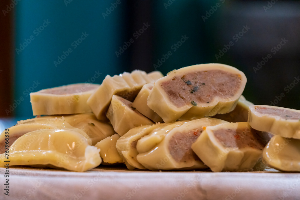 Fresh cut Maultaschen before cocking at pan with other ingredients Fresh cut Maultaschen before cocking at pan with other ingredients