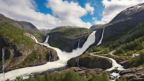 Embark on a holiday trip in a motorhome, experiencing the freedom of caravan car vacation. Travel along the road to witness the majestic Latefossen Waterfall in Odda, Norway, a powerful twin waterfal photo