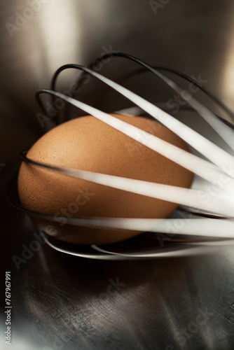 Brown egg with a whisk © belekekin