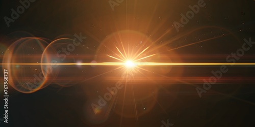 A yellow lens flare with a black background