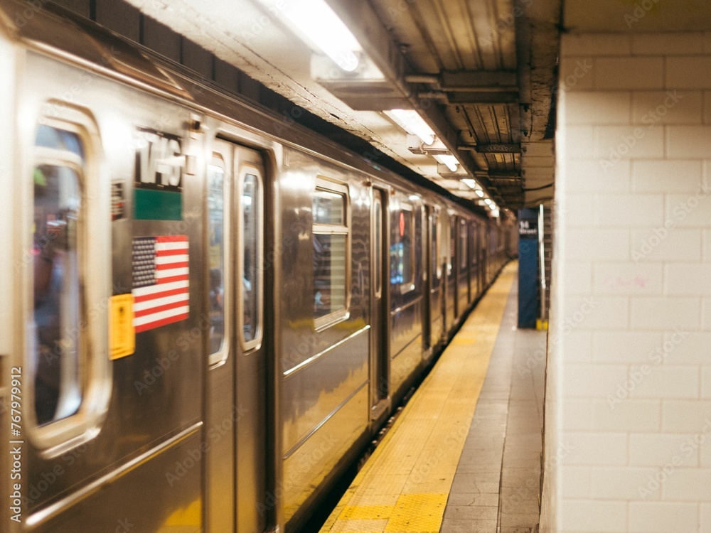 Obraz premium Moving train in a subway station in New York City