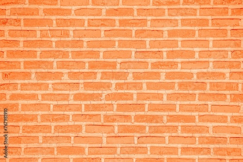 Close-up view of a brick wall featuring subtle cracks in the surface