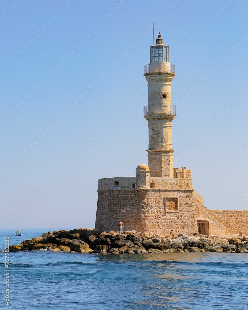 Old Town Chania tower surrounded by the ocean and sky in Greece