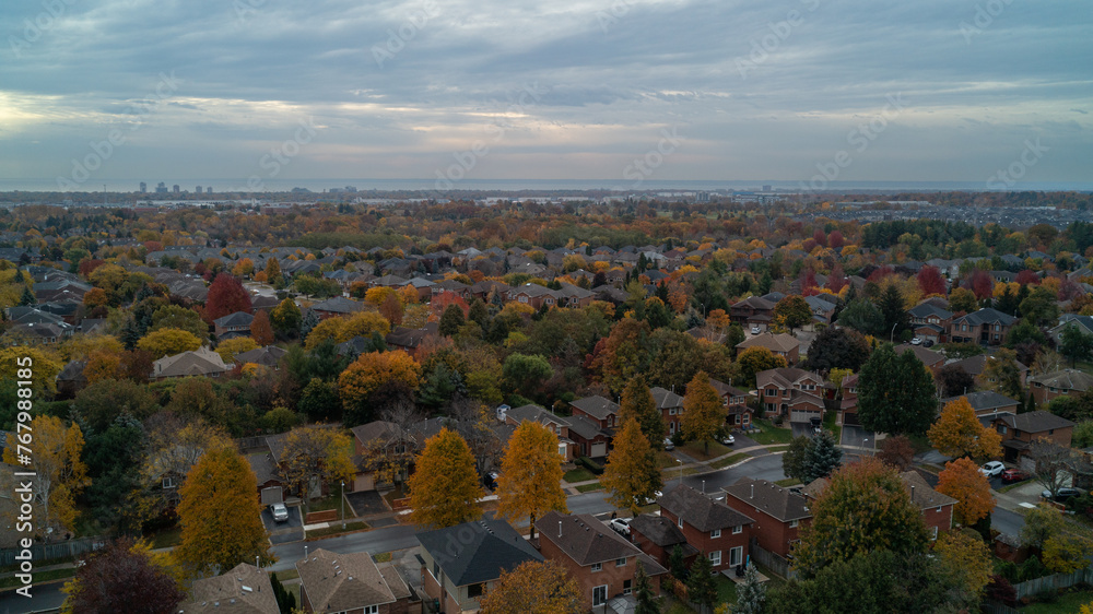 An aerial view of a colorful Suburban Town in the fall