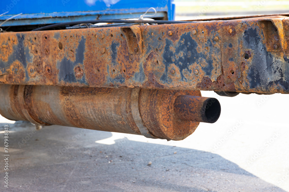 Rusty muffler and exhaust pipe of a truck. Rusty muffler and exhaust pipe of a truck.