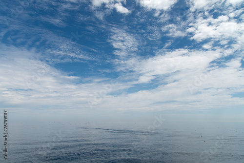 Seascape with the white clouds at the harbor photo