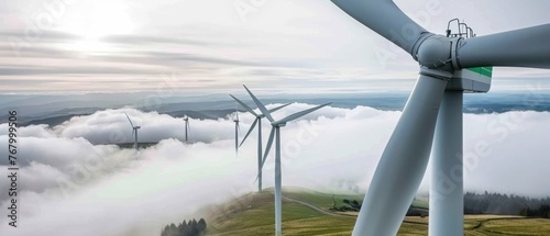 Electricity generation with renewable energy, electric, wind power plant, wind power energy concept - Close up of wind turbine park photo