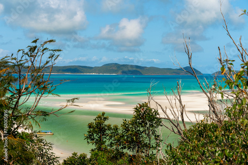A beautiful beach with a boat in the water whitsunday