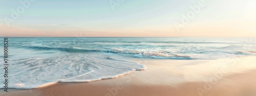 a minimalist promotional banner showcasing the serene moment of sea water gently hitting the sandy beach at dawn.
